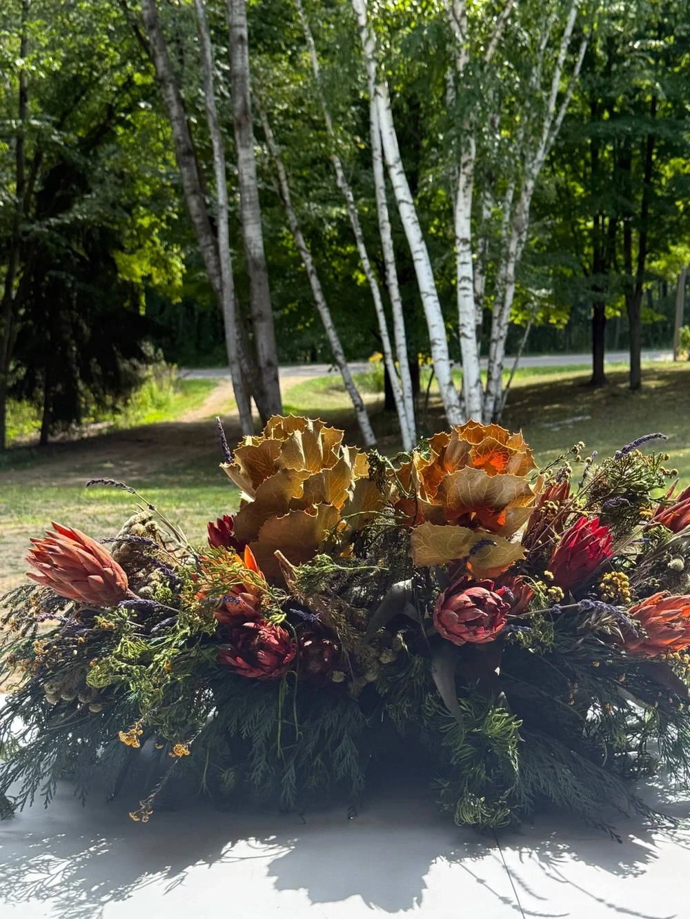 Autumn table center piece or decoration floral leaves full in planter box